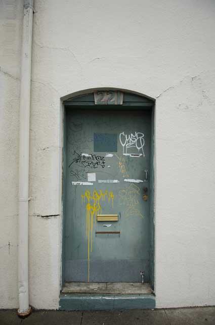 A door on an empty building on Washington Street near Jack London Square in Oakland.